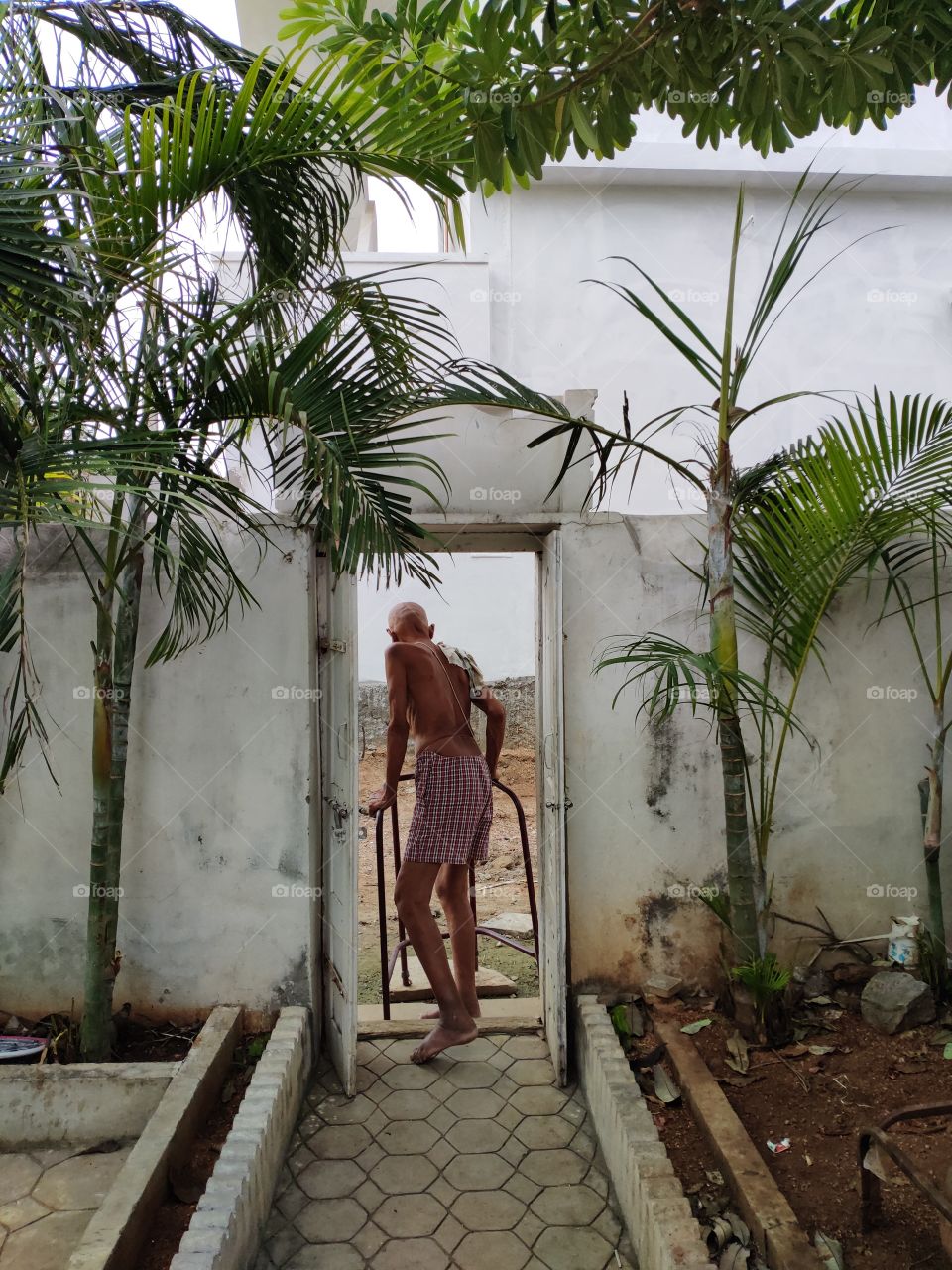 Old-aged Person Standing at  home lonely