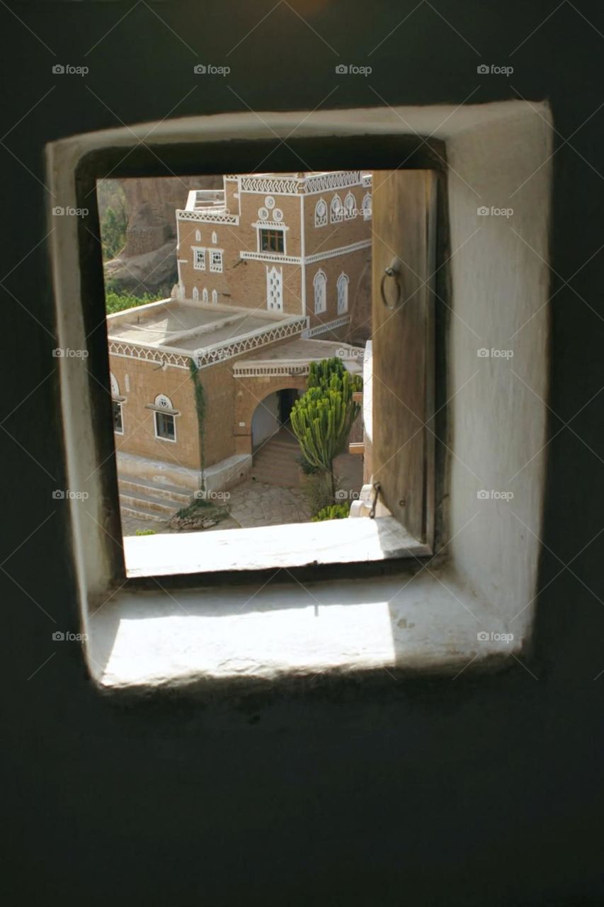 A stunning view of green mountains covered in fog in Yemen