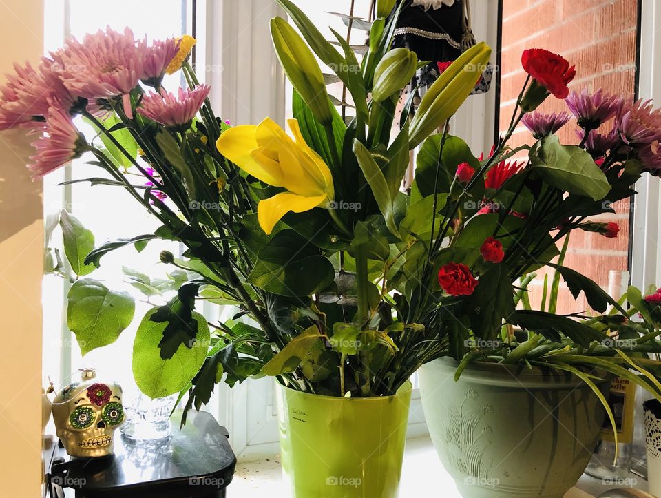 A fresh bouquet of flowers in a vase in the sun
