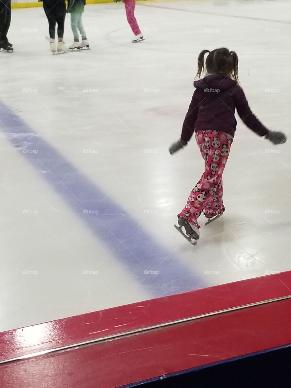 small girl ice skating