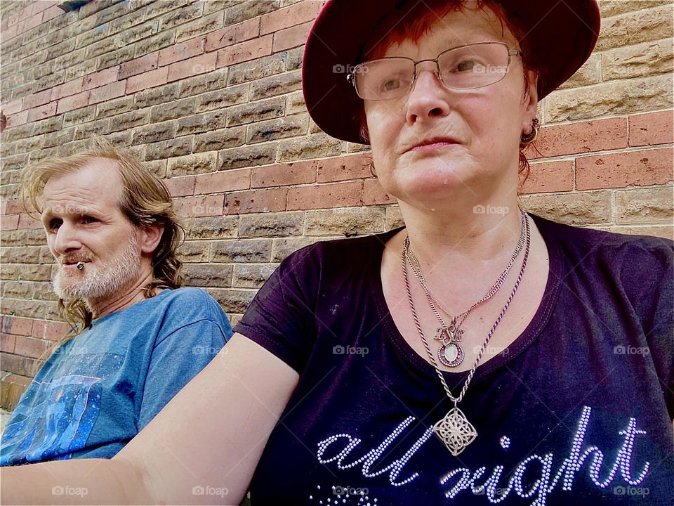 I, „Petra Schiller“ and „Timothy Trespas“, my significant other for some sixteen plus years are sitting near our favorite stoop on „Waverly Av“ off „Fulton St“ in „Fort Greene“, Brooklyn. 2023. Hypnotic Productions