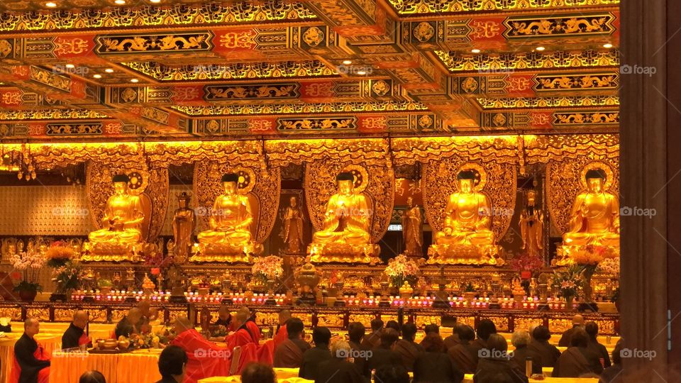 The Monks praying, meditating and chanting in the Room of the 5 Thousand Buddhas. The Po Lin Monastery. Ngong Ping Village, Po Lin Monastery, Lantau Island, Hong Kong. 