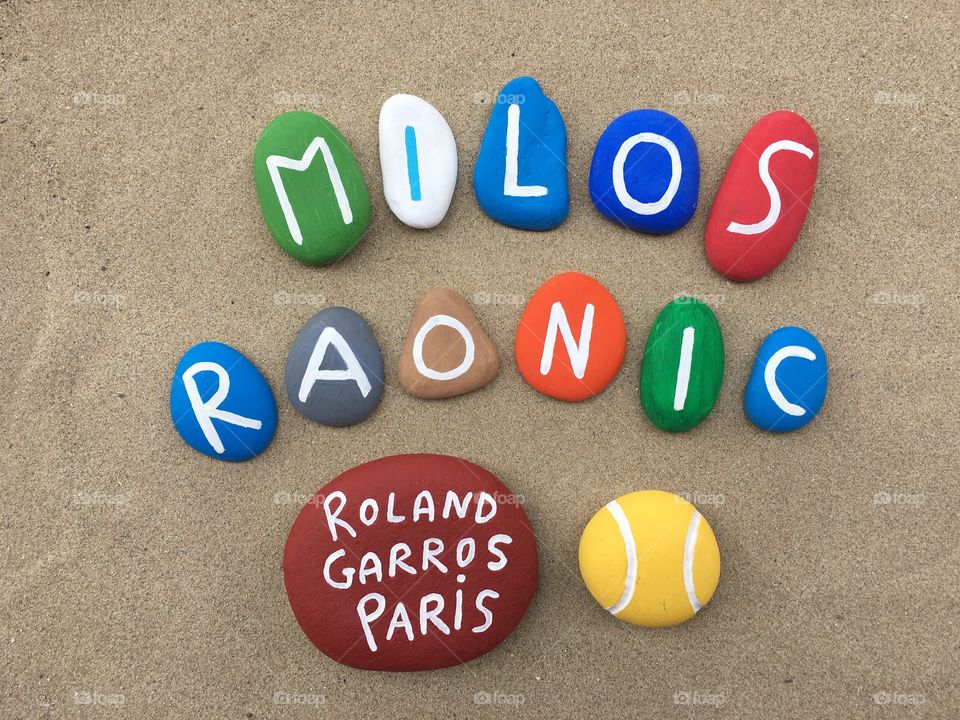 Milos Raonic, canadian professional tennis player at Roland Garros, souvenir on colored stones 