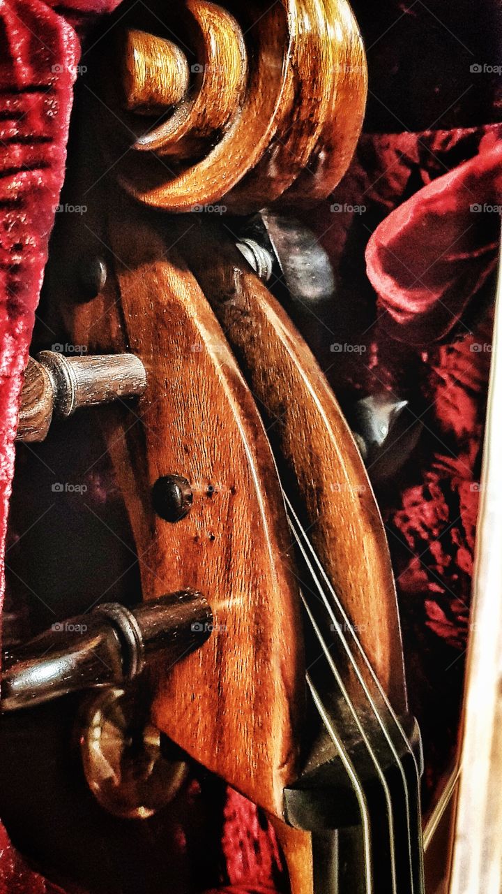Cello resting in its case until needed again