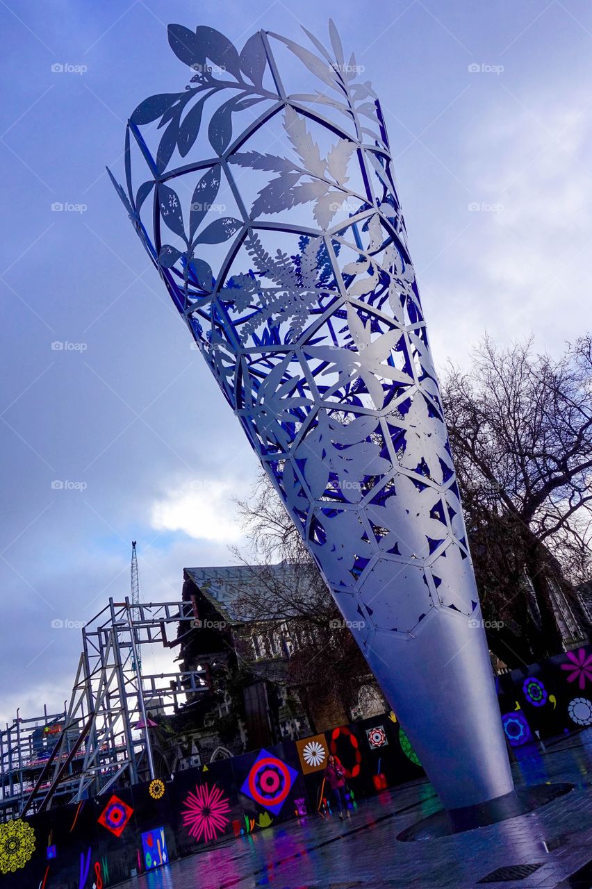 The Chalice sculpture in Christchurch’s Cathedral Square, New Zealand. You can still see the damage done to the front of the cathedral by the 2011 earthquake.