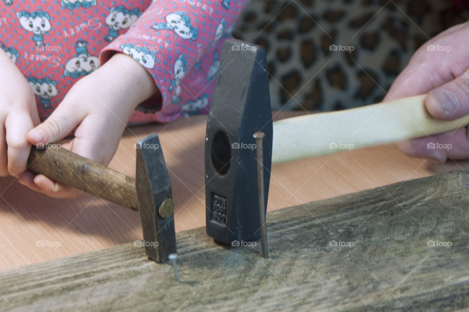 little girl holding tools