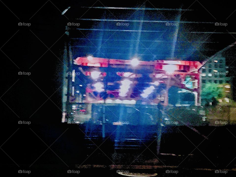 The multicolored neon lights display underneath the Pulaski Bridge in Long Island City, Queens, New York up close photographed one late night in October 2020. Hypnotic Productions