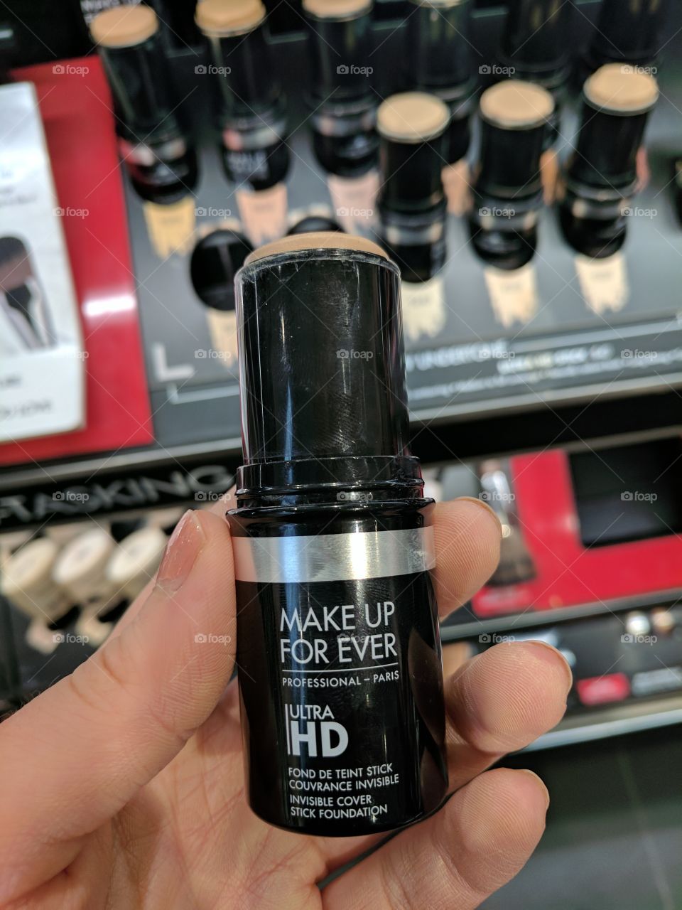 Makeup Forever Ultra HD Invisible Cover Stick Foundation at Sephora with Female hand