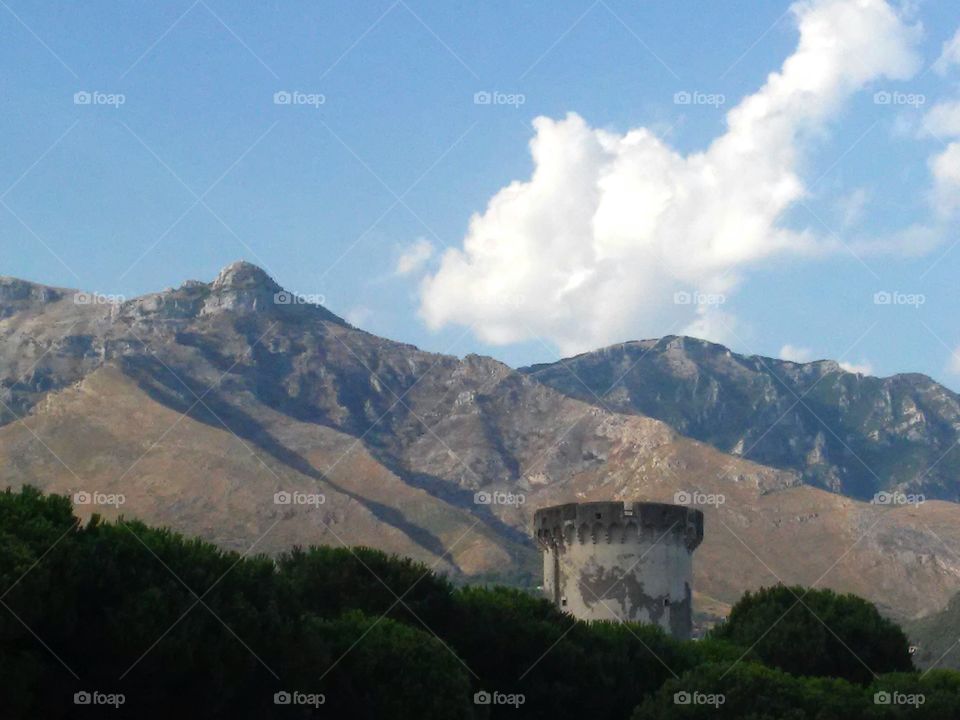 Mountains. Watchtower rises in front of mountains