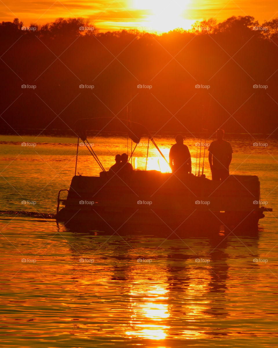 Fisherman  bringing in the catch of the day under a glamorous sunset!
