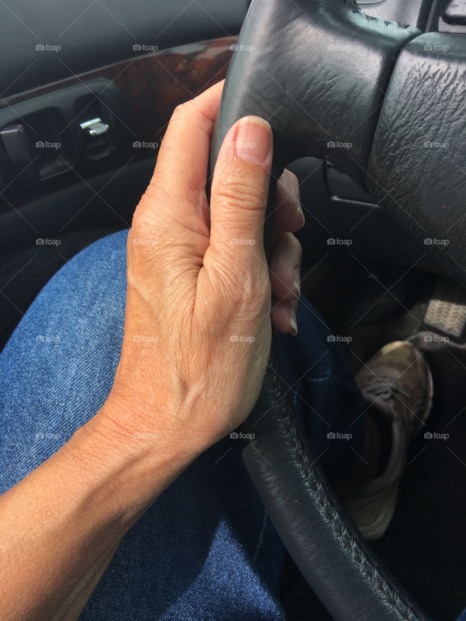 Side of hand on the wheel 