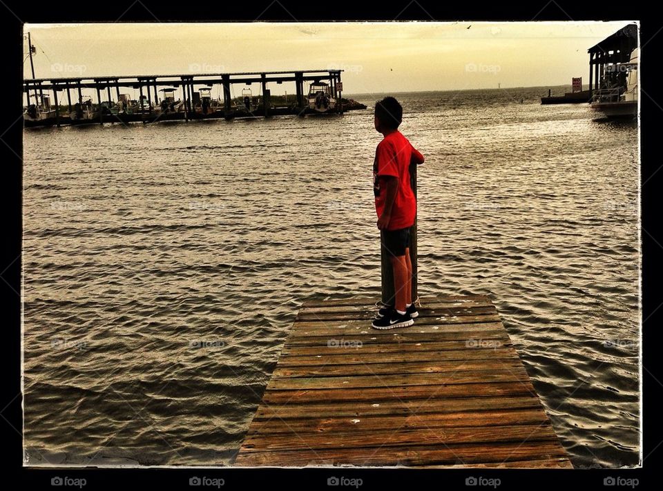 Boy on pier