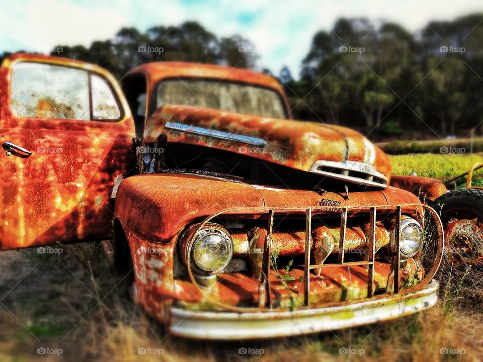 Rusty Old Truck. Beat Up Vintage Truck During Golden Hour
