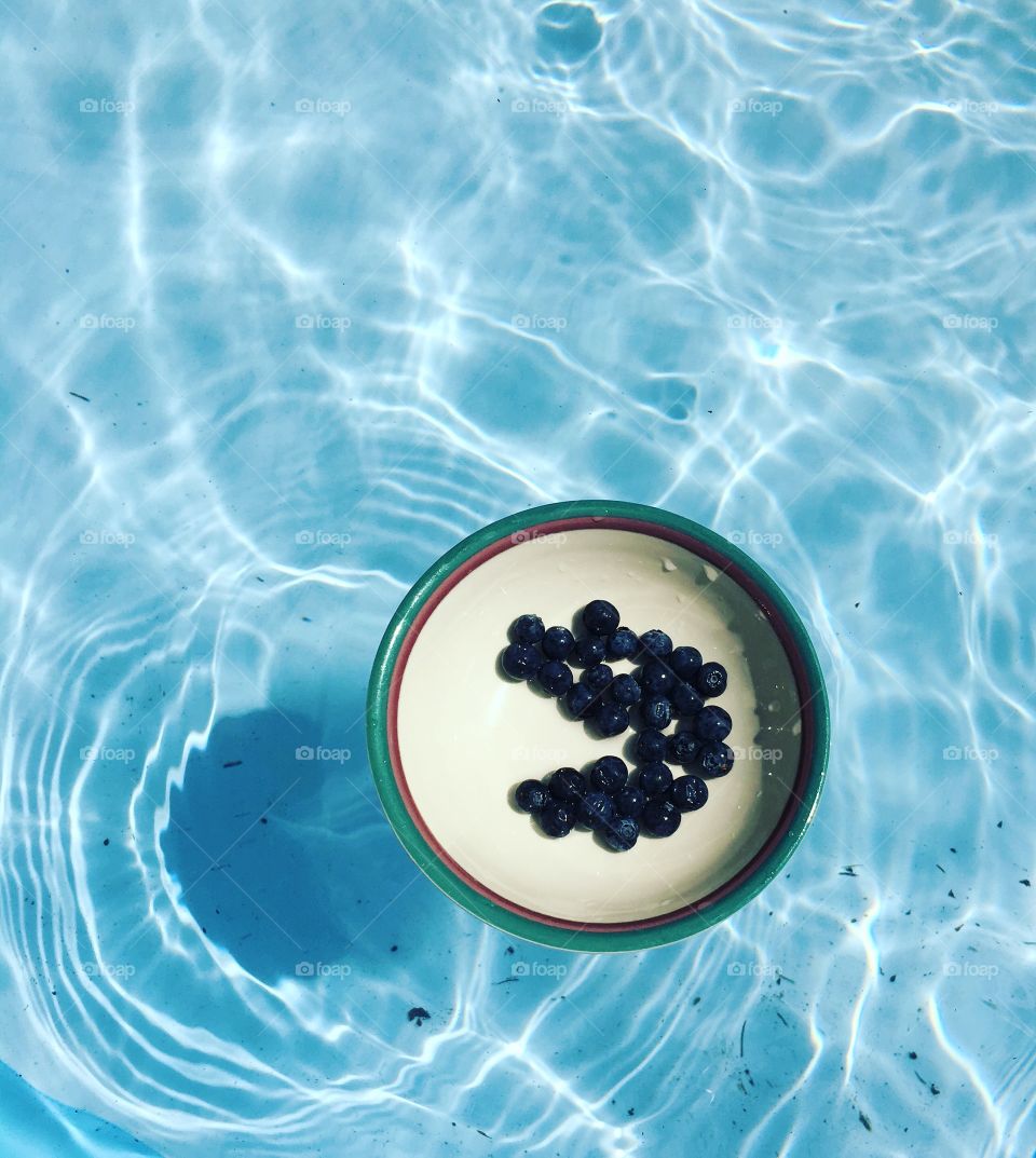 Fun with blueberries in the pool. 