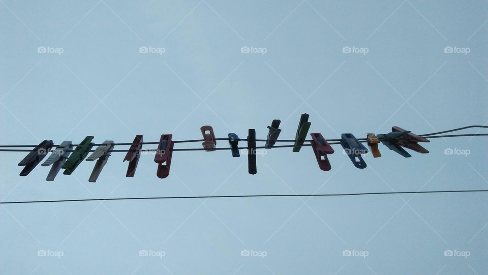 Colored handles hanging in wires.