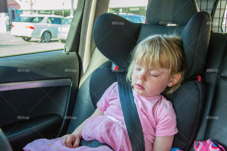 Sleeping child in car.