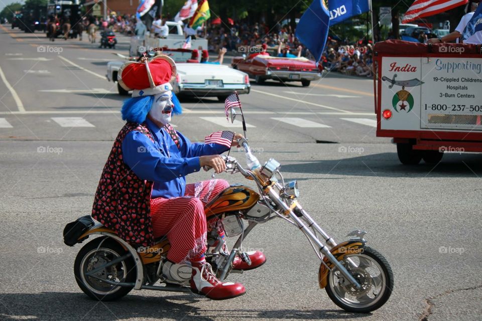 Bike Riding Clown in Parade. July 4th Parade