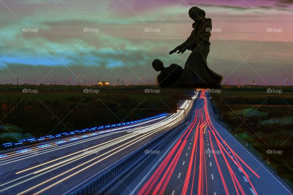 exposed highway main road with cars vehicles going to see statues