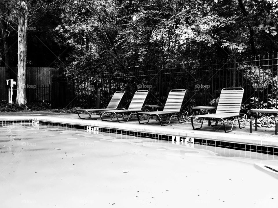 Empty Chaises at Pool