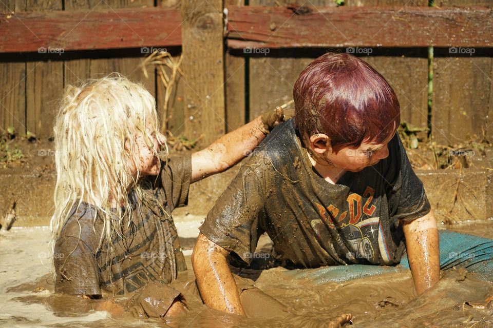 Kids Playing In Mud