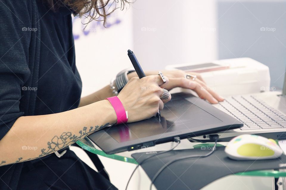 A girl using a graphic tablet