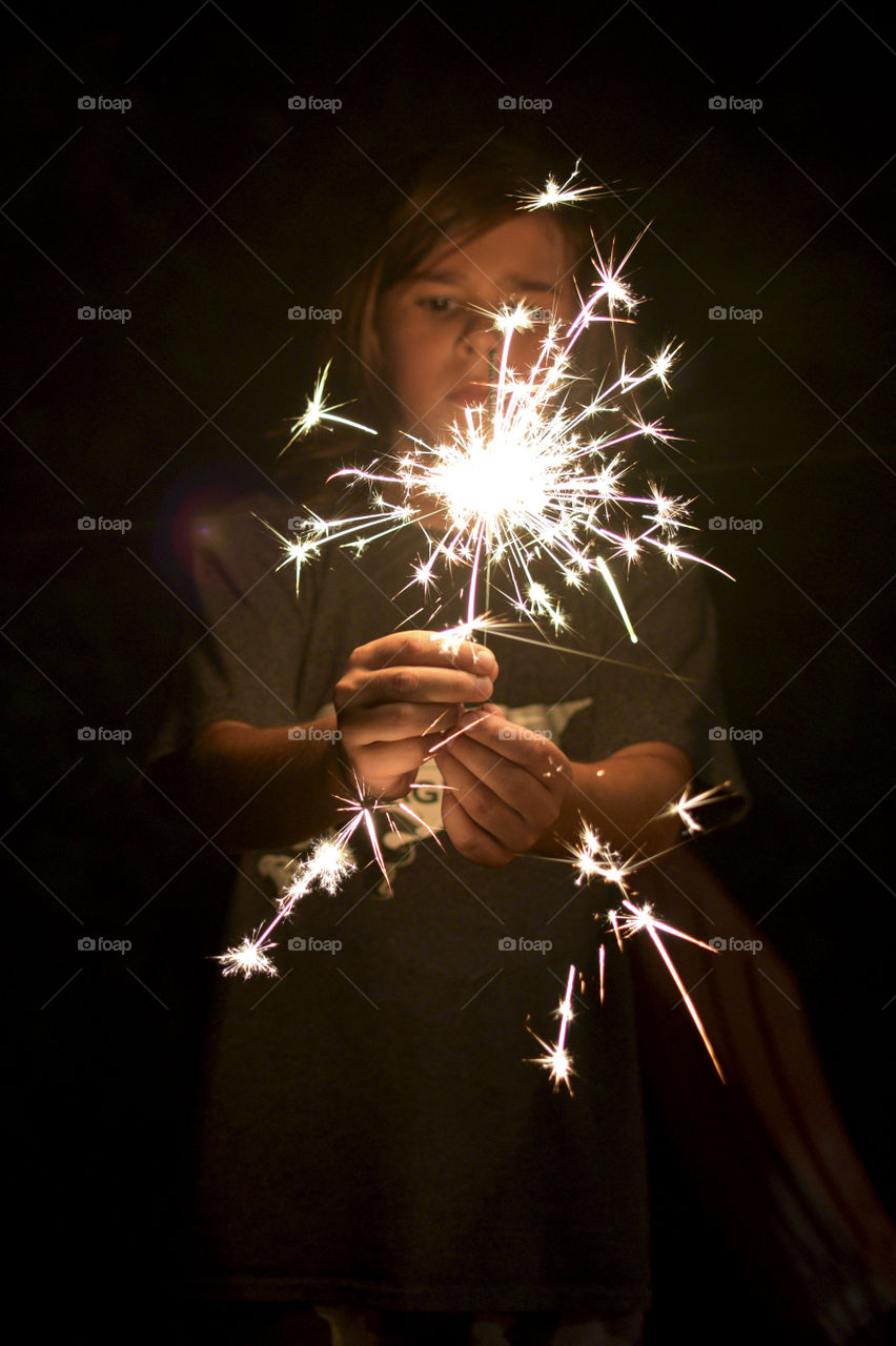 Close-up of a girl holding sparkler