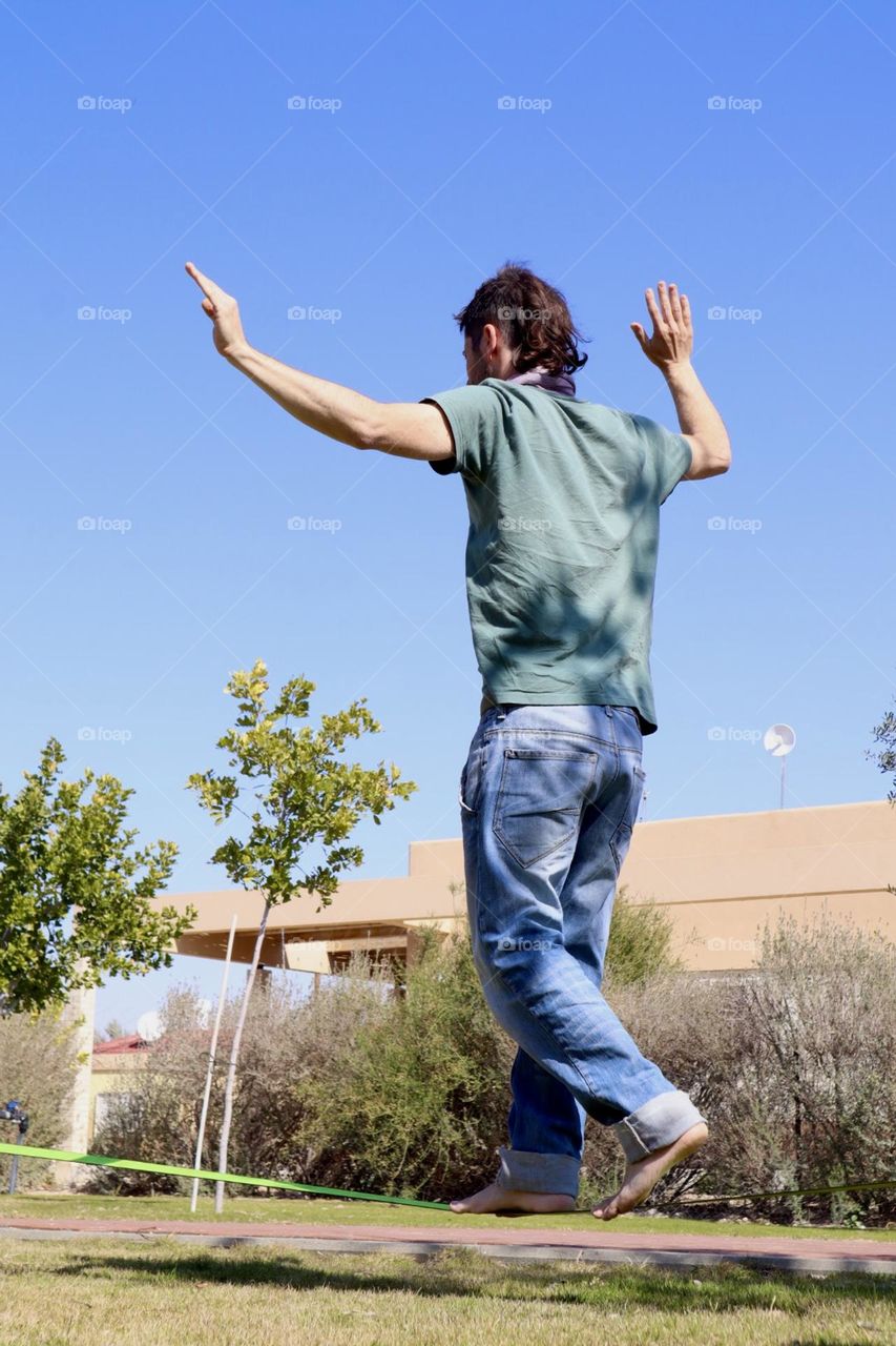 Cool father practice tightrope walk