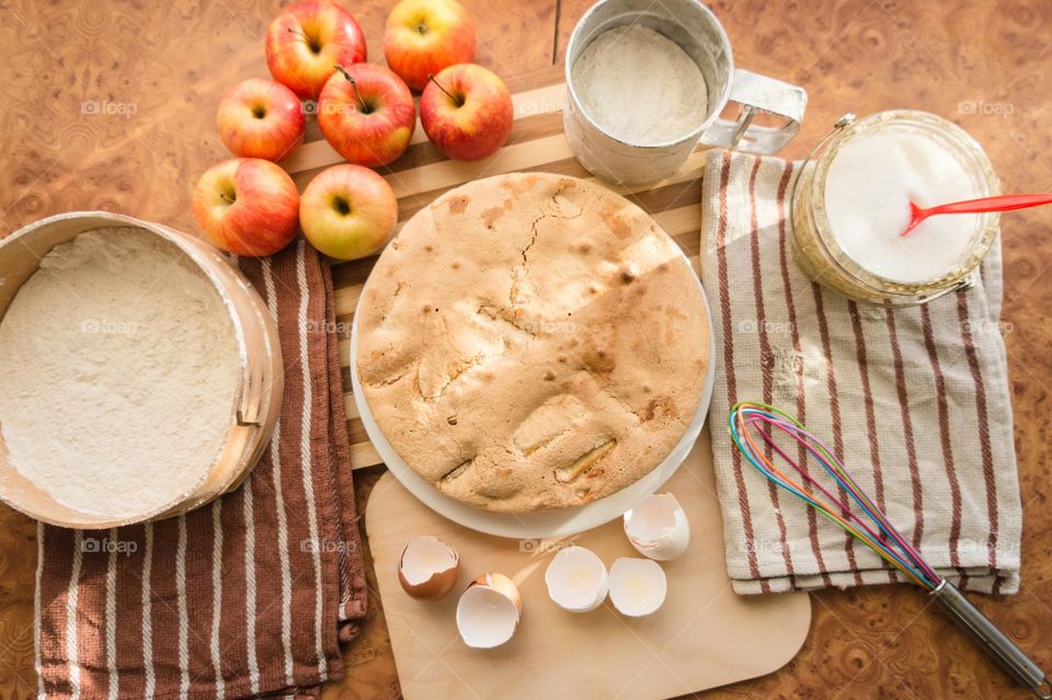 Making homemade puffed apple pie with eggs, sugar and flour.