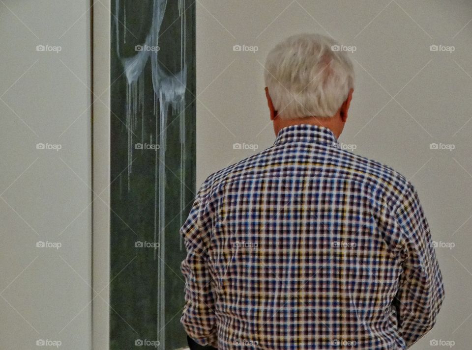 Older Man In An Art Gallery