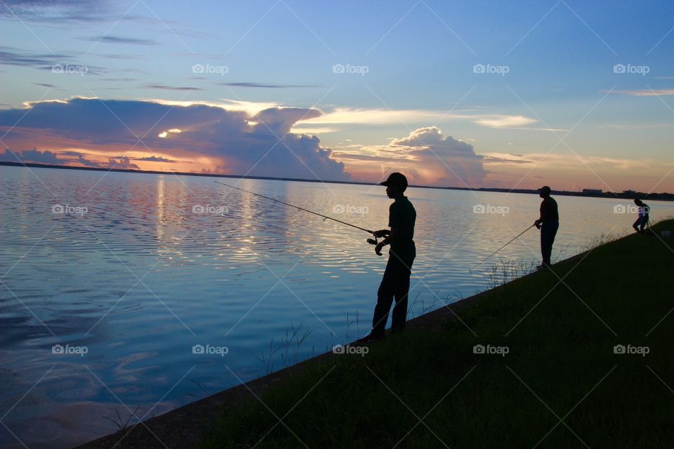 Fishing silhouette sunrise