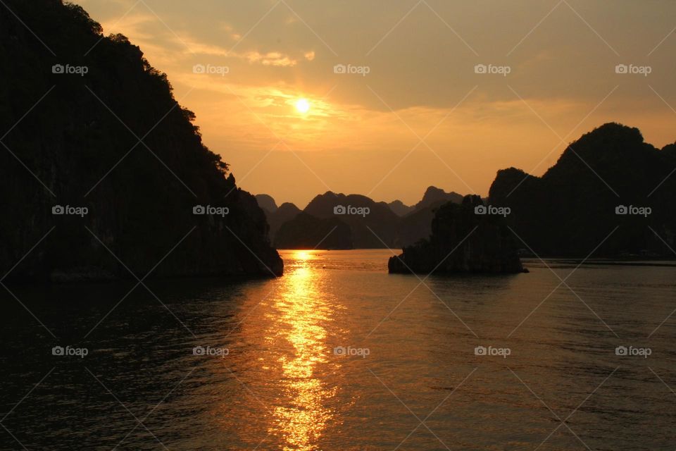 Sunset over Ha Long Bay in Vietnam taken from a boat cruise.