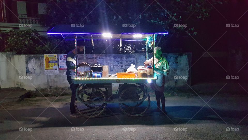 old man selling peanut