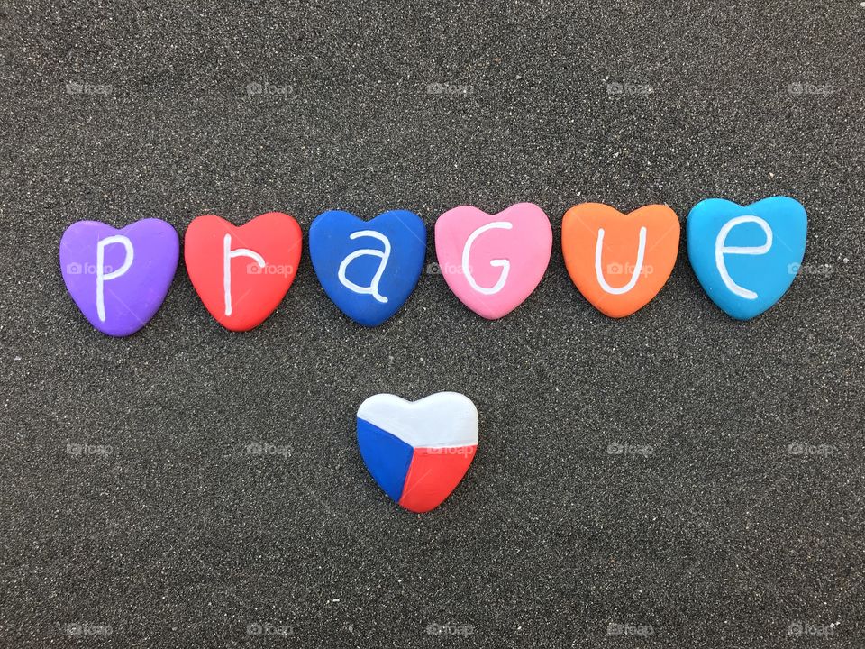 Prague, Czech Republic, souvenir with colored heart stones over black volcanic sand