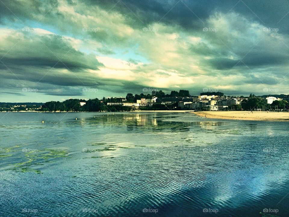 Scenic view of sea against storm cloud