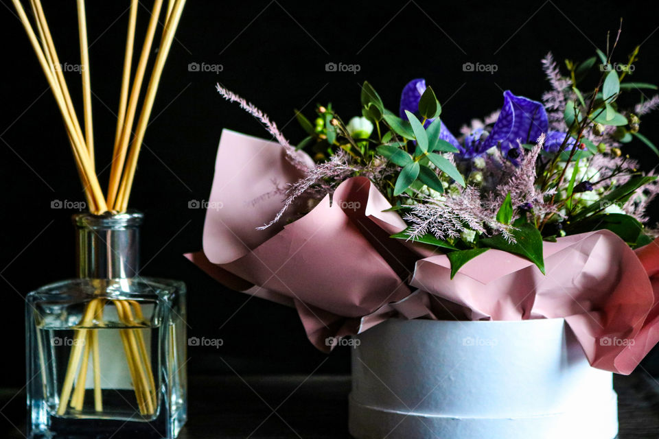 Scented sticks and floral arrangement