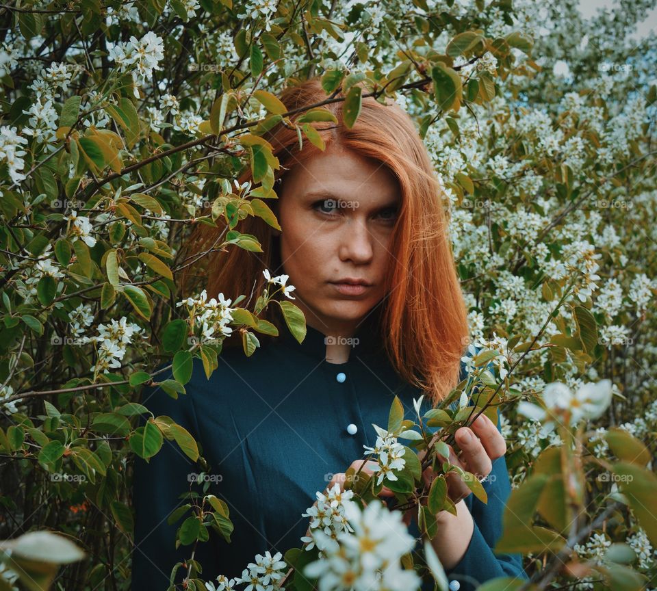 Woman standing near tree