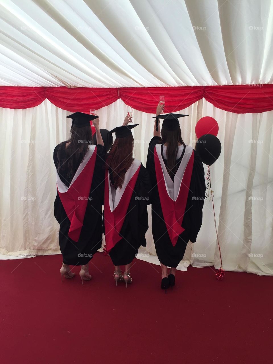 Back view of girls in graduation dress 