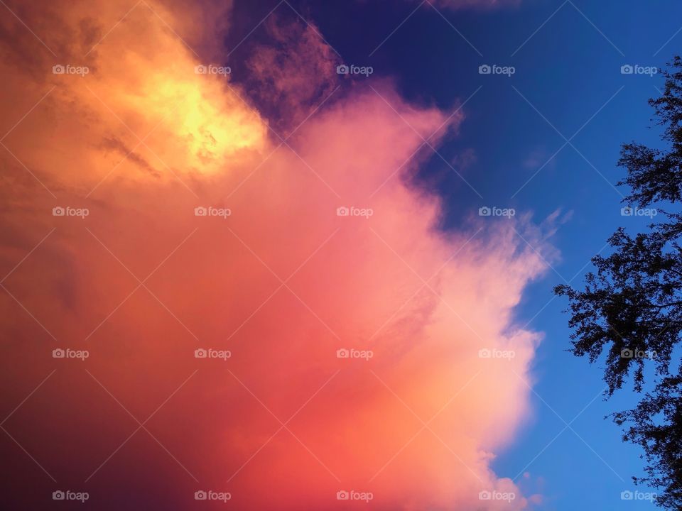 Pink and orange sunset after a storm.