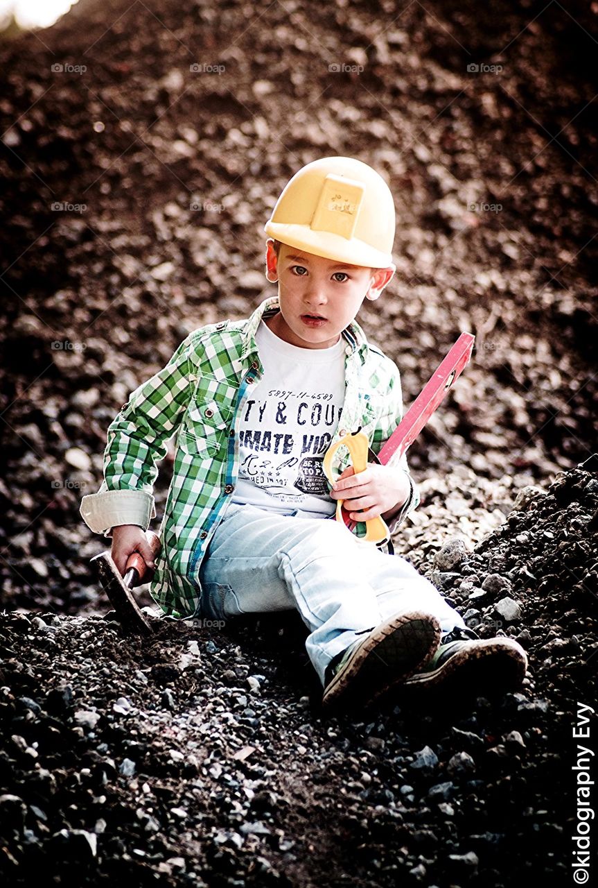 Little boy builder Looking cool