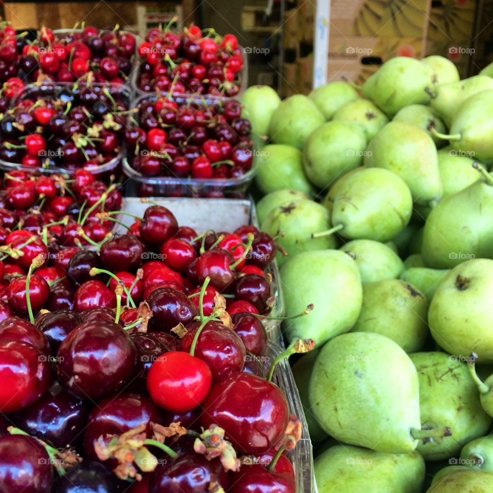 The BEST cherries you'll ever eat next to beautiful pears at the shuk in Jerusalem