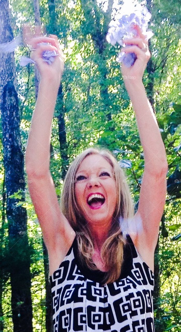 Throwing flower peddles 