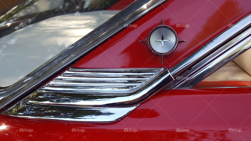 the rear window panel of a ford galaxie starliner showing the vhrome detail