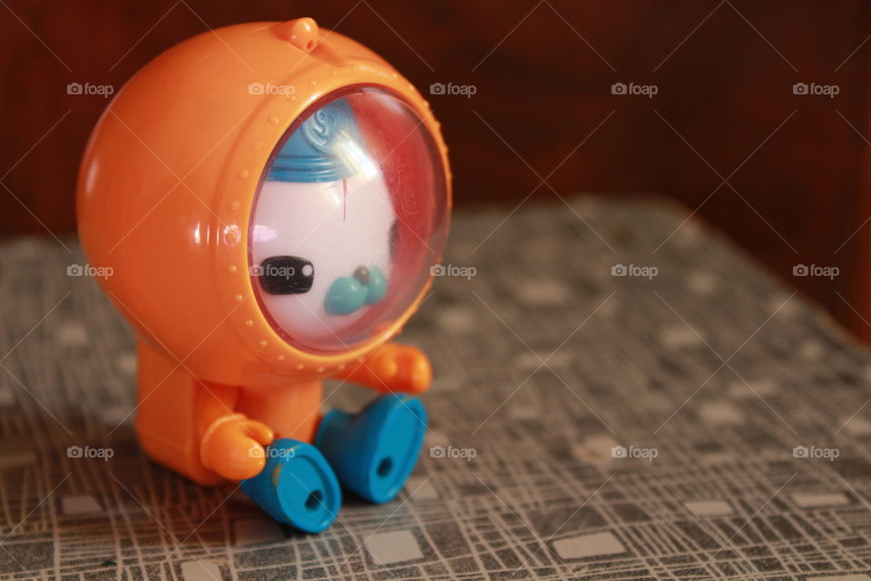 plastic toy of a cat in a astronaut suit