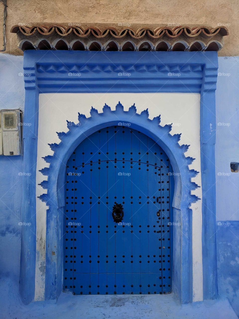 Ornate Decorative Blue and White Door (Arch) in Chefchaouen (The Blue City) in Morocco