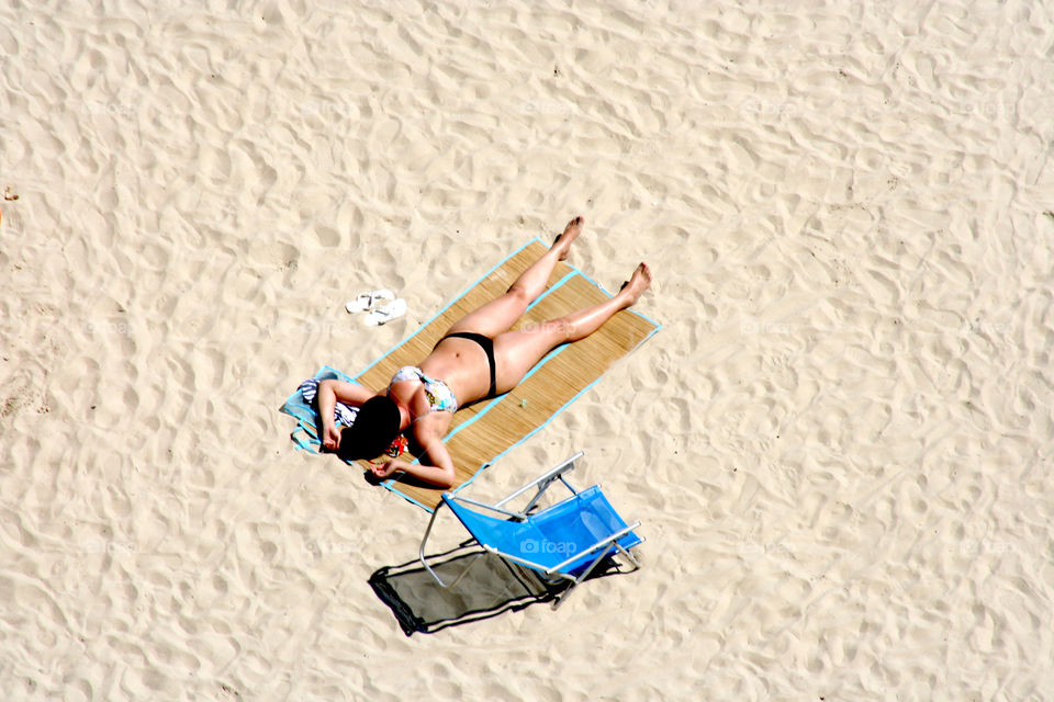 Girl sunbathing on the beach