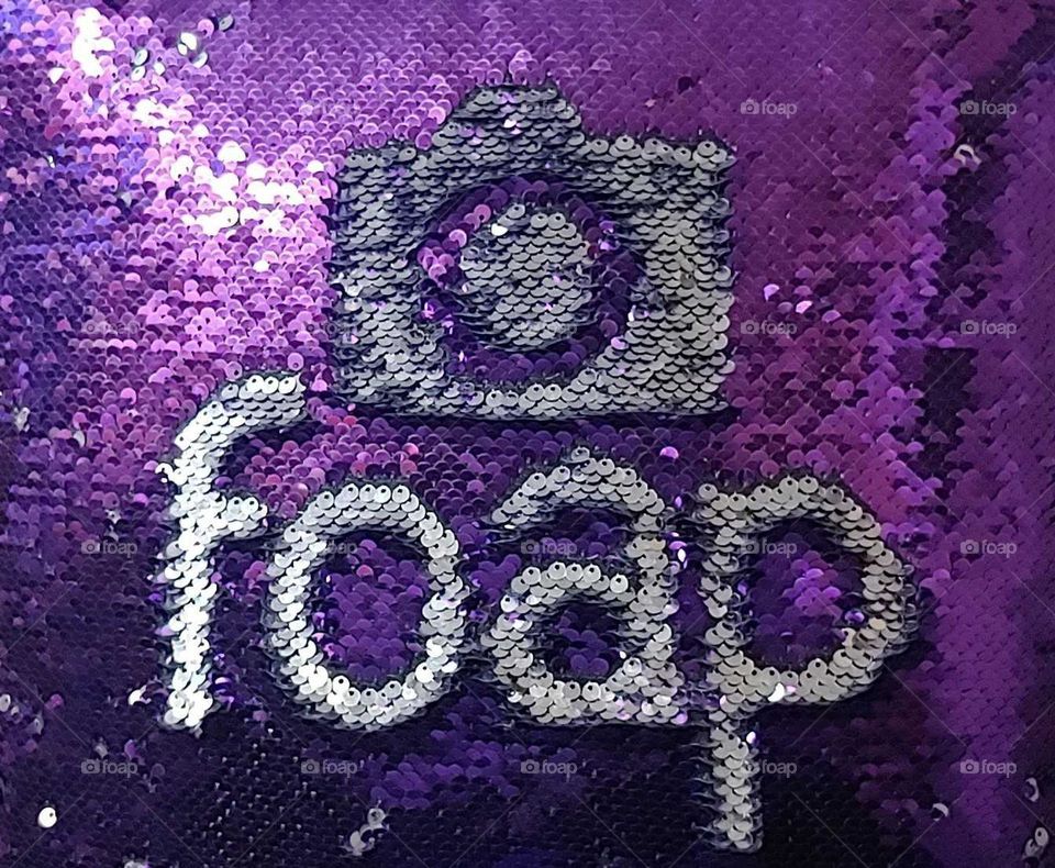 Doodle drawing on a purple sequin pillow.foap fun