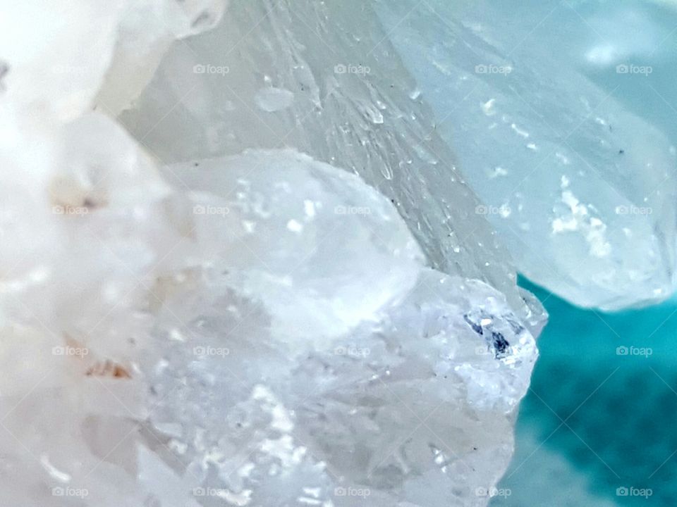 Tiny crystal growths on a small quartz crystal point.