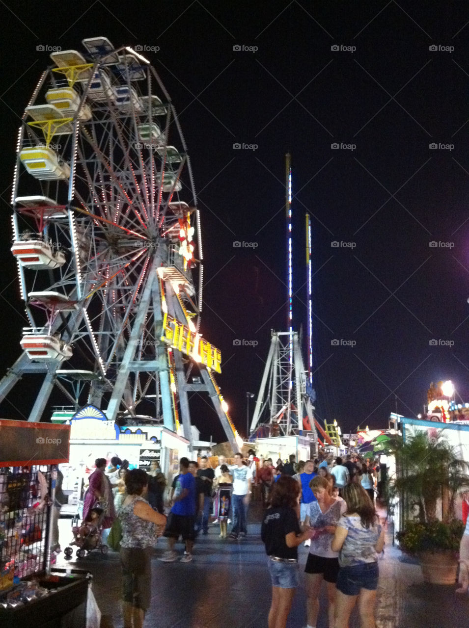board walk night amusement park ferris wheel by IphonePhotographer