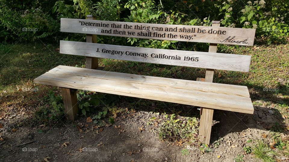 a bench with an inscription of one of Lincoln's famous quotes, at the Abraham Lincoln Memorial Gardens