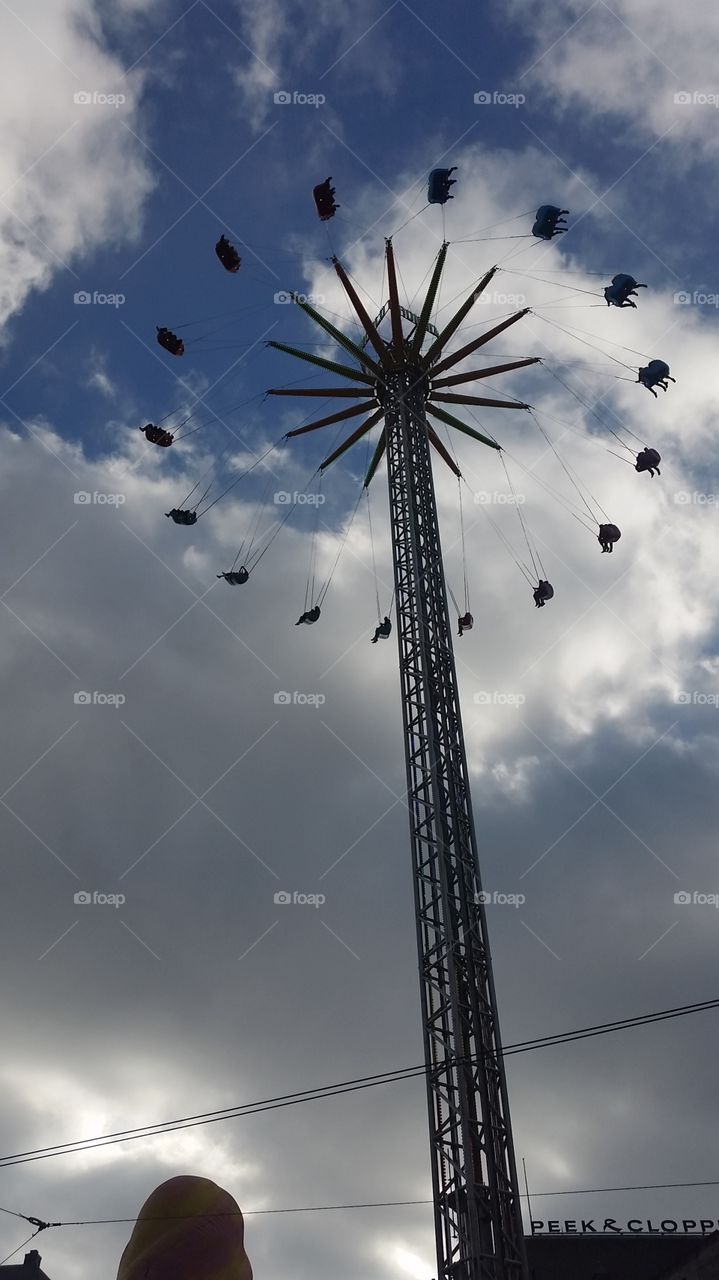 A high up carousel in the middle of AMSTERDAM 